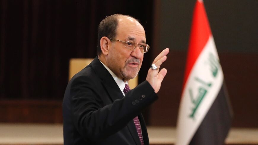 Former Iraqi prime minister Nouri al-Maliki leaves after casting his ballot at a polling station in Baghdad