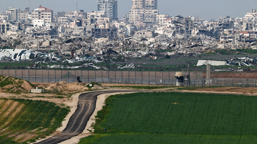 A field on the Israeli side of the Israel-Gaza border in southern Israel, January 21, 2026. Destruction in Gaza can be seen in the background. REUTERS/Amir Cohen