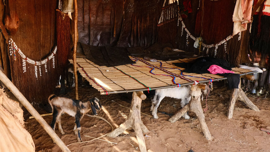 A sheep stands under a bed inside a nomad's tent, El Obeid, North Kordofan, Sudan, January 20, 2026. REUTERS/El Tayeb Siddig