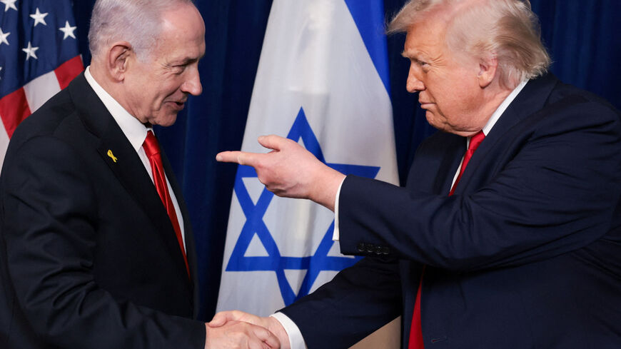 U.S. President Donald Trump points his finger towards Israeli Prime Minister Benjamin Netanyahu as they shake hands during a press conference after meeting at Trump’s Mar-a-Lago club in Palm Beach, Florida, U.S., December 29, 2025. REUTERS/Jonathan Ernst