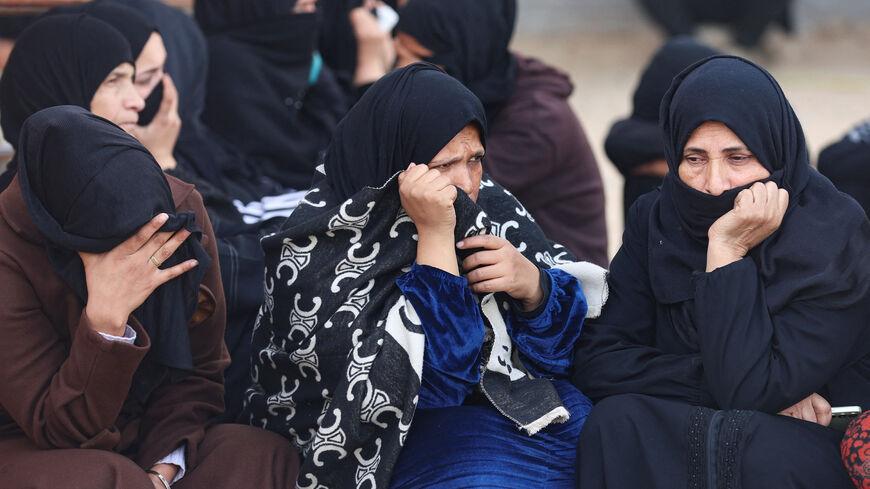 Mourners attend the funeral of Palestinians killed in an overnight Israeli strike, according to medics, at Nasser Hospital in Khan Younis in the southern Gaza Strip, February 15, 2026. REUTERS/Ramadan Abed