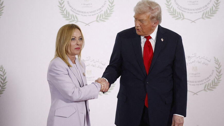FILE PHOTO: U.S. President Donald Trump and Italian Prime Minister Giorgia Meloni shake hands as they pose for a photo, at a world leaders' summit on ending the Gaza war, amid a U.S.-brokered prisoner-hostage swap and ceasefire deal between Israel and Hamas, in Sharm el-Sheikh, Egypt, October 13, 2025. Yoan Valat/Pool via REUTERS/File Photo