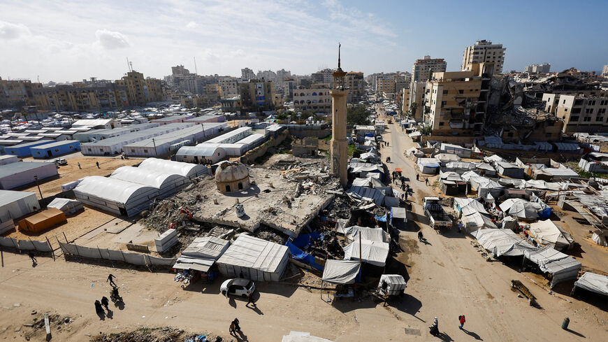 A mosque, destroyed during the two-year Israeli offensives, is surrounded by tents for displaced Palestinians, in Gaza City, February 11, 2026. REUTERS/Mahmoud Issa