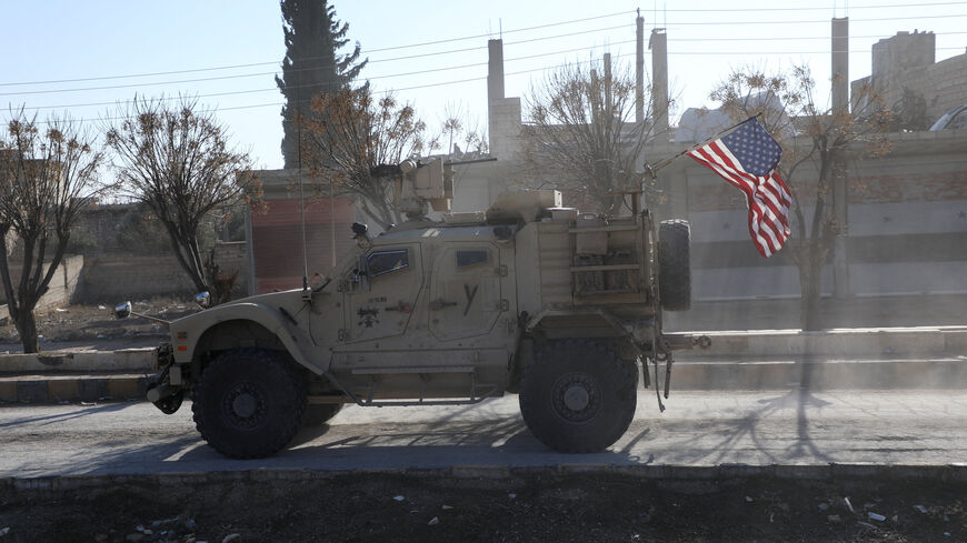 FILE PHOTO: A U.S. military vehicle moves on a road on the day of a meeting between the Syrian Democratic Forces (SDF) leaders and U.S. military leaders, in Deir Hafer, Syria. January 16, 2026. REUTERS/Orhan Qereman/ File Photo