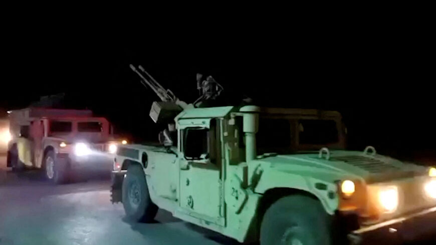 Military vehicles move on a road in a location given as Nangarhar, Afghanistan, in this screengrab from a handout video released on February 26, 2026. Pakistani and Afghan border forces clashed on Thursday night after the Taliban launched what it called retaliatory strikes on Pakistani installations, sharply escalating tensions after days of cross-border hostilities. Afghanistan's Ministry of Defense/Handout via REUTERS