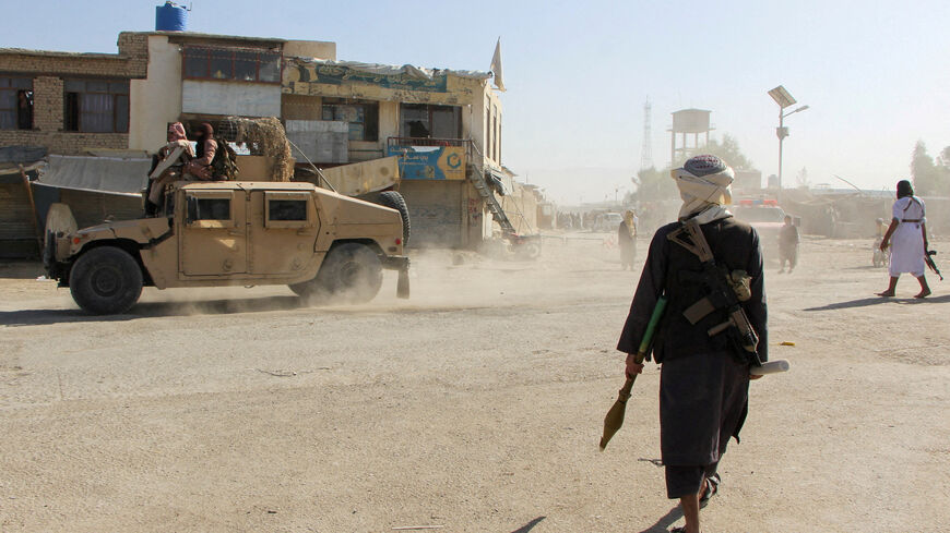 FILE PHOTO: Afghan Taliban fighters patrol near the Afghanistan-Pakistan border in Spin Boldak, Kandahar Province, following exchanges of fire between Pakistani and Afghan forces in Afghanistan, October 15, 2025. REUTERS/Stringer/File Photo