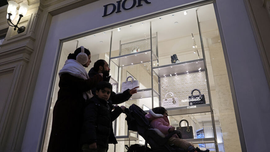 Tourists from Oman, Hilal Al-Ghaithi and his family members, walk past a closed Dior shop at the GUM department store in Moscow, Russia February 1, 2026. REUTERS/Anastasia Barashkova