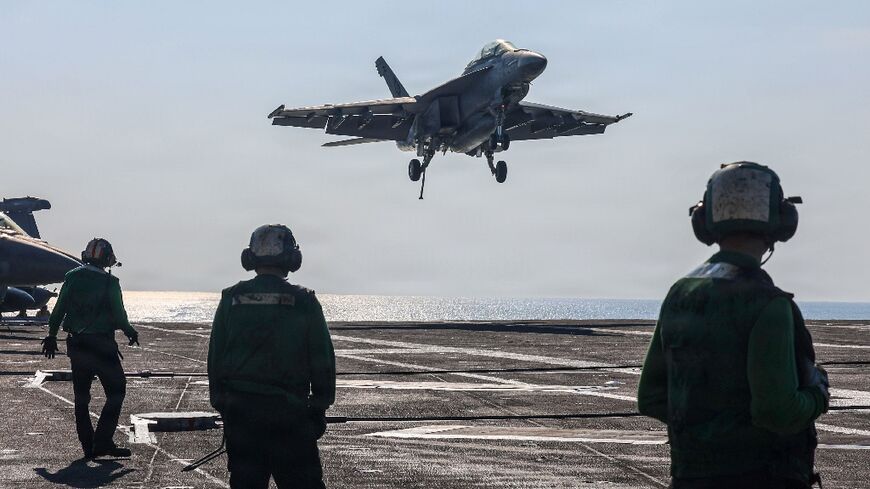 A US naval battle group led by the aircraft carrier USS Abrahem Lincoln is in waters near Iran. (Handout photograph) 