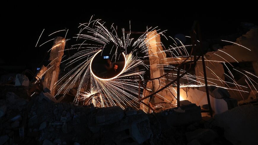 Displaced Palestinian light up fireworks in Gaza as Ramadan begin