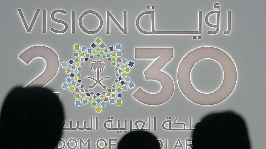 Saudi women stand next to the Saudi pavilion (vision 2030) at the Gitex 2018 exhibition at the Dubai World Trade Center in Dubai on Oct. 16, 2018. 