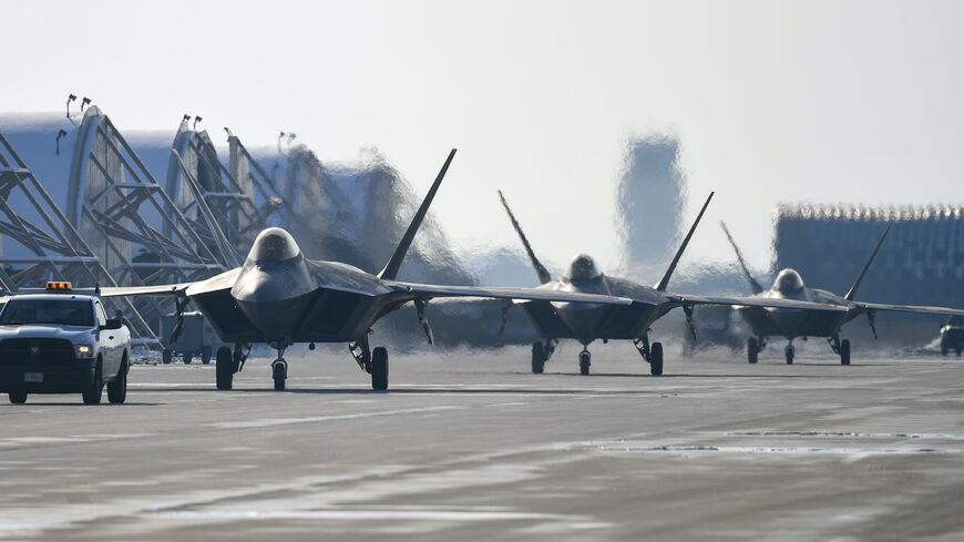 In this handout image released by the South Korean Defense Ministry, US F-22 fighter jets move after landing at the Kunsan airbase during the joint air drills on Dec. 20, 2022 in Kunsan, South Korea. 