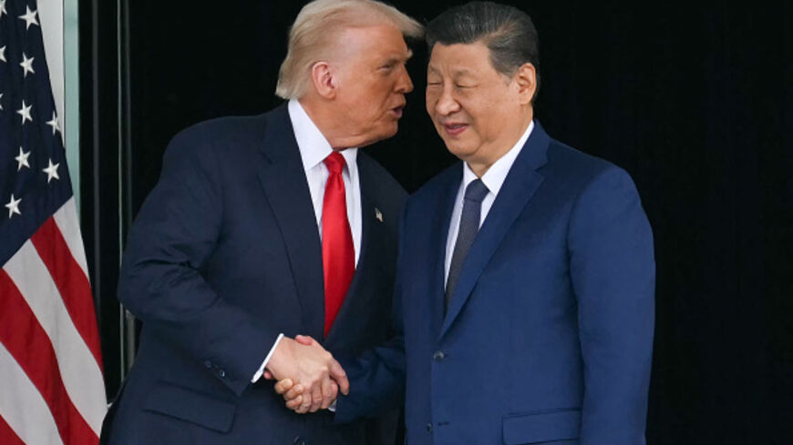 US President Donald Trump and Chinese President Xi Jinping shake hands after talks at the Gimhae Air Base, in Busan, Oct. 30, 2025. (Andrew Caballero-Reynolds/AFP via Getty Images)