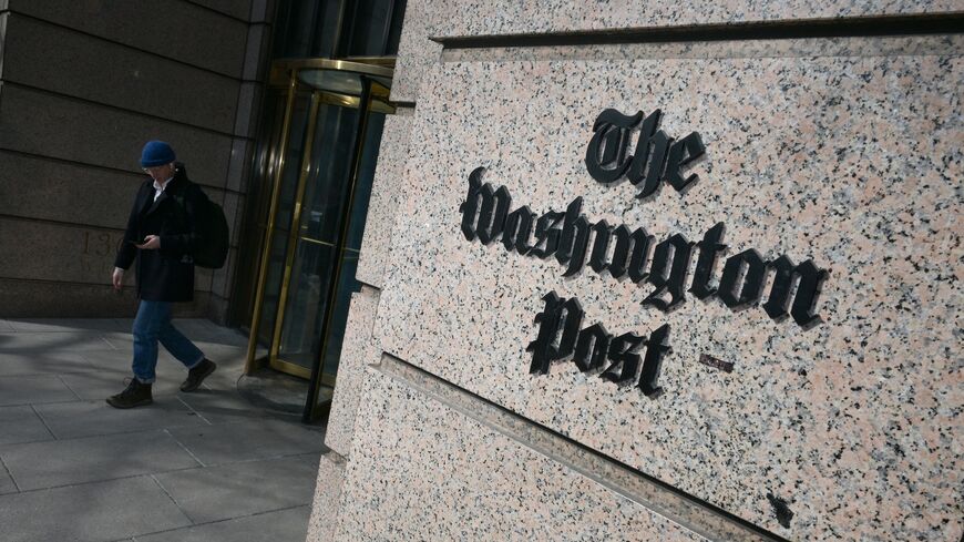 A man exits the Washington Post office building in Washington, DC, on Feb. 4, 2026. 