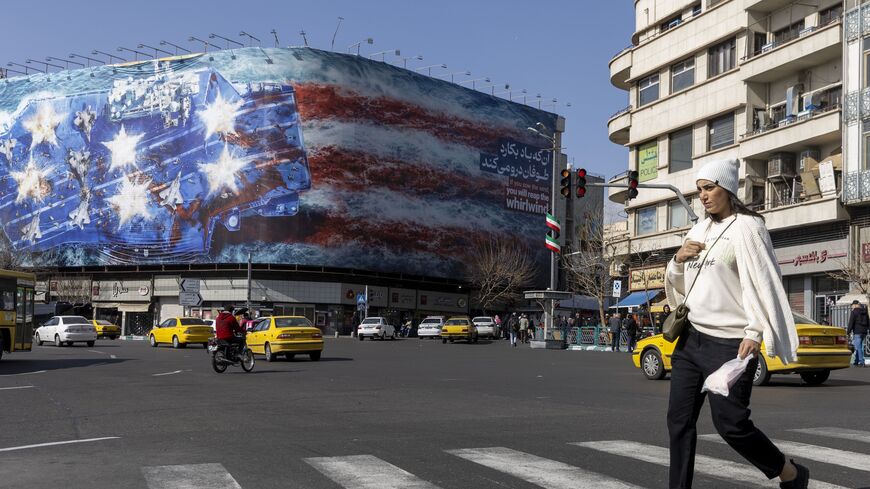 A state building is covered with a giant anti-US billboard depicting a symbolic image of the destroyed USS Abraham Lincoln aircraft carrier in downtown Tehran, Iran, on Feb. 1, 2026. 