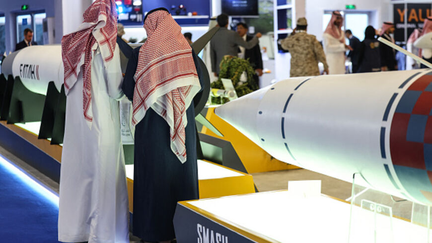 Visitors stand in front of a Fatah-II guided rocket (L) and a SMASH anti-ship missile during the World Defence Show in Riyadh on February 9, 2026. (Fayez Nureldine / AFP via Getty Images)