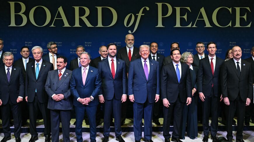 US President Donald Trump (C), flanked by US Vice President JD Vance (L) and US Secretary of State Marco Rubio (R), joins leaders for a group photo during the inaugural meeting of the Board of Peace at the US Institute of Peace in Washington, on Feb. 19, 2026.