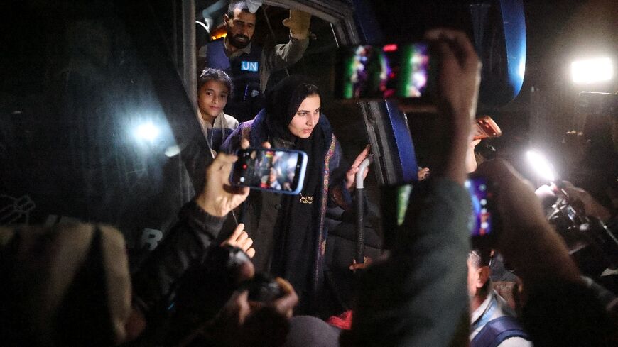 Palestinians arrive at a hospital in Khan Yunis after crossing from Egypt