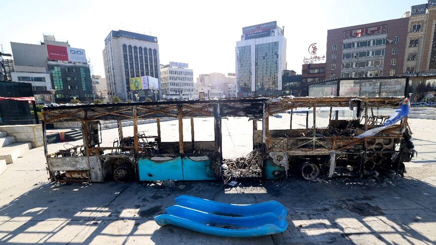 A destroyed bus in Tehran's Haftome-tir Square
