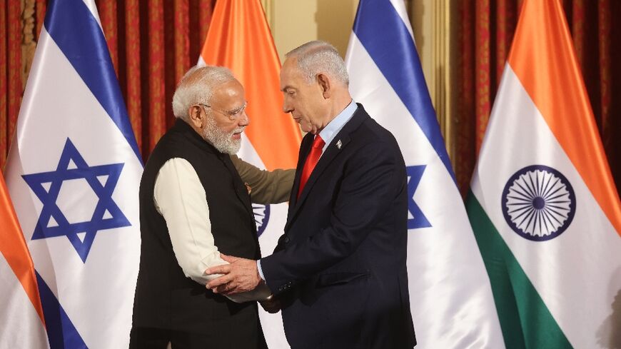 Modi shakes hands with Netanyahu during the Indian leader's visit to Israel