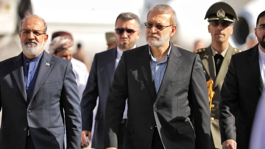 A handout photo made available by Iran's Supreme National Security Council office shows Secretary of the Supreme National Security Council Ali Larijani (C) arriving in Muscat, Oman, on Feb. 10, 2026. 