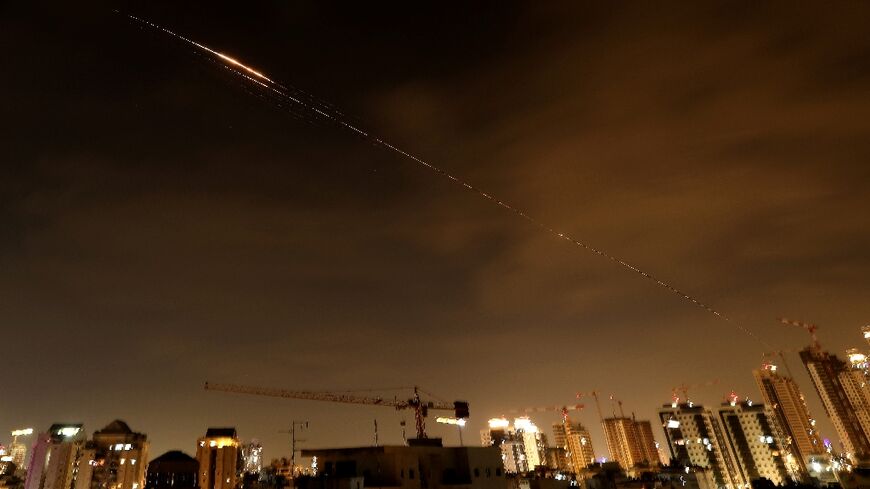 Rocket trails seen in the sky above the Israeli coastal city of Netanya early on Monday