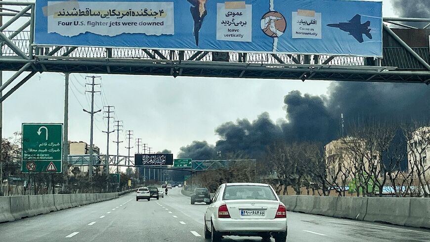 As Tehran residents returned to work on Sunday, black smoke from Israeli oil depot strikes rise into the air
