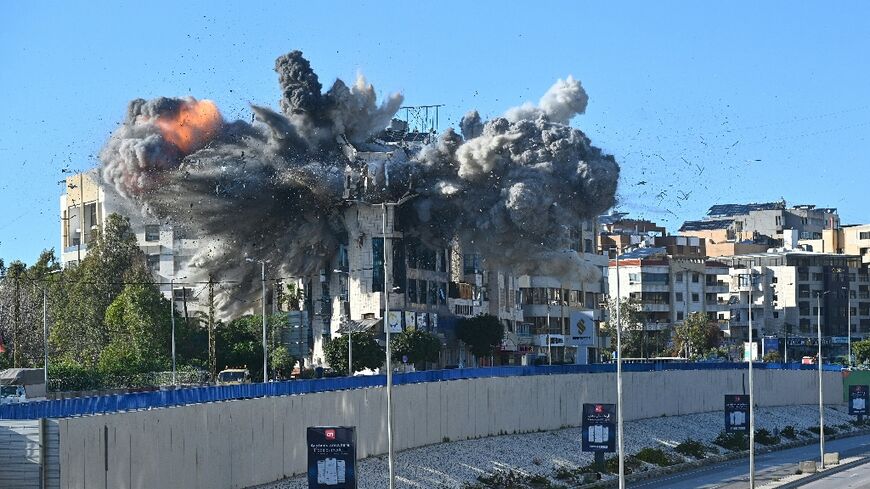 A ball of fire rises from the site of an Israeli strike on a building adjacent to the highway that leads to Beirut's international airport on March 31, 2026