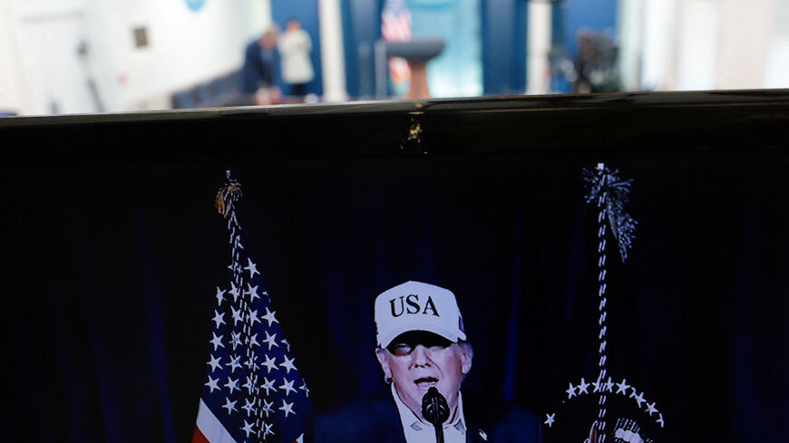 A television monitor shows U.S. President Donald Trump's earlier announcement in the otherwise empty press briefing room at the White House, while U.S. President Trump is away at his Mar-a-lago Club in Palm Beach, Florida, on the day the United States and Israel led attacks on Iran, in Washington, D.C., U.S., February 28, 2026. REUTERS/Jonathan Ernst