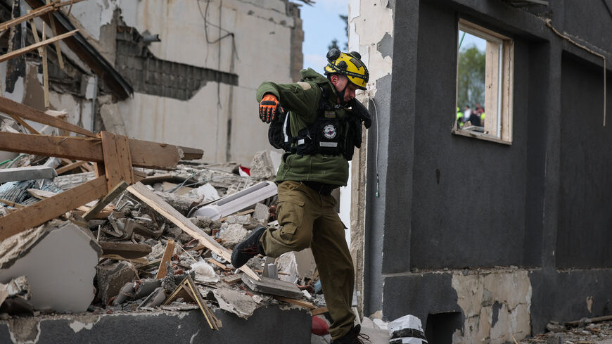 A member of an Israeli search and rescue unit at the site of an Iranian strike, after Iran launched missile barrages following attacks by the U.S. and Israel on Saturday, in Beit Shemesh, Israel March 1, 2026. REUTERS/Ammar Awad