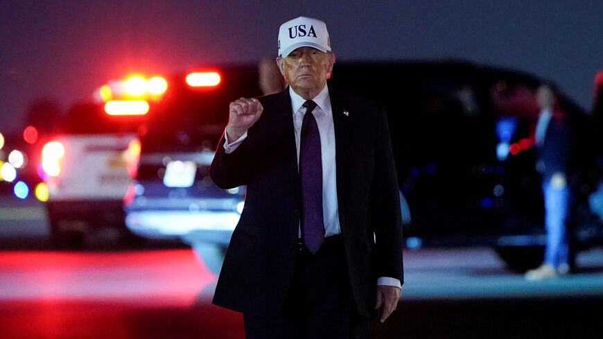 U.S. President Donald Trump pumps his fist after disembarking Air Force One at Palm Beach International Airport in West Palm Beach, Florida, U.S., February 27, 2026. REUTERS/Elizabeth Frantz