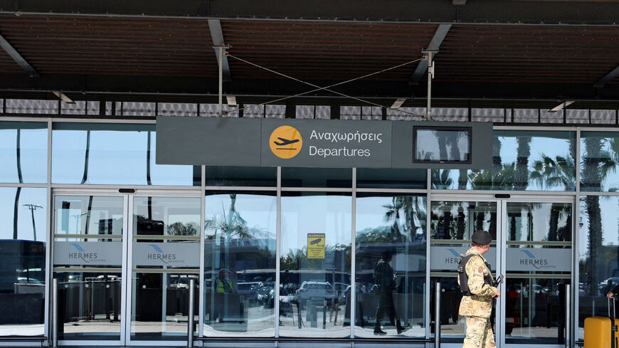 Police officer patrols at Paphos International Airport in Paphos, Cyprus January 27, 2025.  REUTERS/Yiannis Kourtoglou