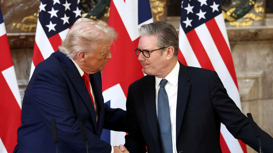 U.S. President Donald Trump and British Prime Minister Keir Starmer shake hands during a press conference following their meeting at Chequers, near Aylesbury, Britain, September 18, 2025. REUTERS/Kevin Lamarque