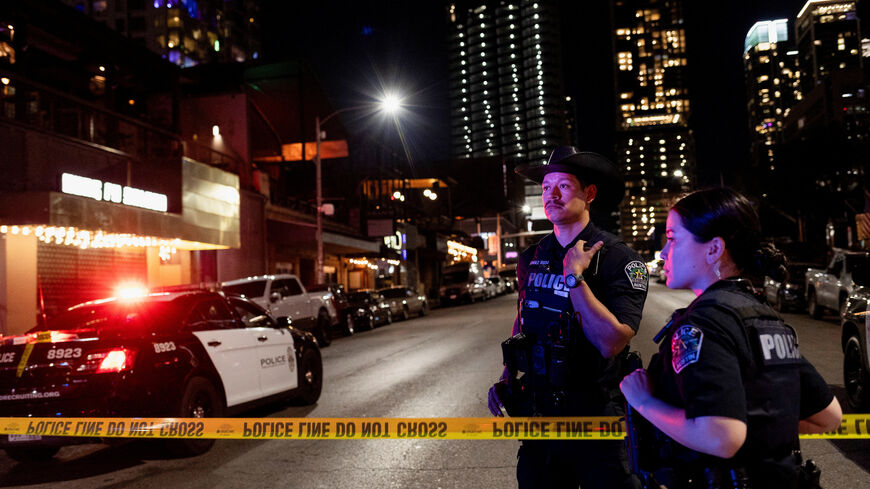 Austin police officers work at the scene after a deadly mass shooting outside Buford's, a popular roadhouse-style bar in Austin, Texas, U.S. March 1, 2026. REUTERS/Nuri Vallbona