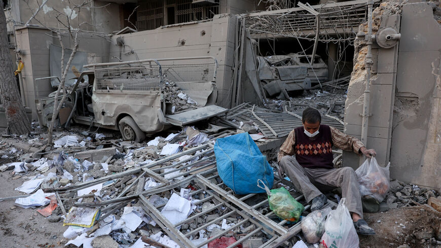 A person sits amid debris following an Israeli and U.S. strike on a police station, amid the U.S.-Israel conflict with Iran, in Tehran, Iran, March 2, 2026. Majid Asgaripour/WANA (West Asia News Agency) via REUTERS