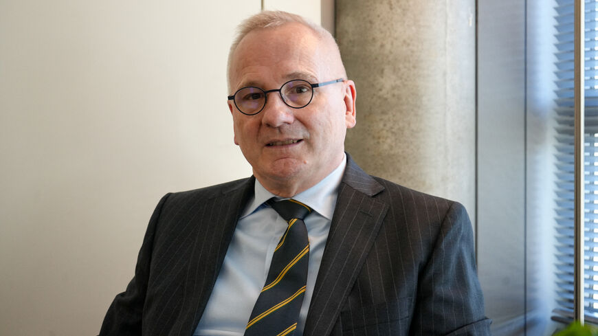 Robert in den Bosch, the Disarmament Ambassador and Permanent Representative to the Conference on Disarmament of the Kingdom of the Netherlands in Geneva, and Chair of the Convention on Certain Conventional Weapons Group of Governmental Experts on Emerging Technologies in Lethal Autonomous Weapons Systems, sits at a desk in his office in Geneva, Switzerland February 25, 2026. REUTERS/Olivia Le Poidevin