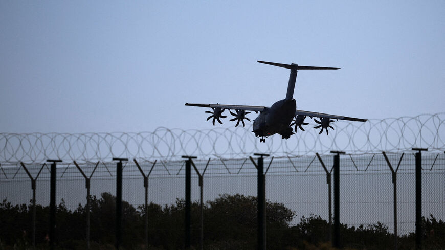An aircraft prepares to land in RAF Akrotiri, a British sovereign base in Cyprus that was hit by a drone early Monday, causing limited damage, in Cyprus. REUTERS/Yiannis Kourtoglou