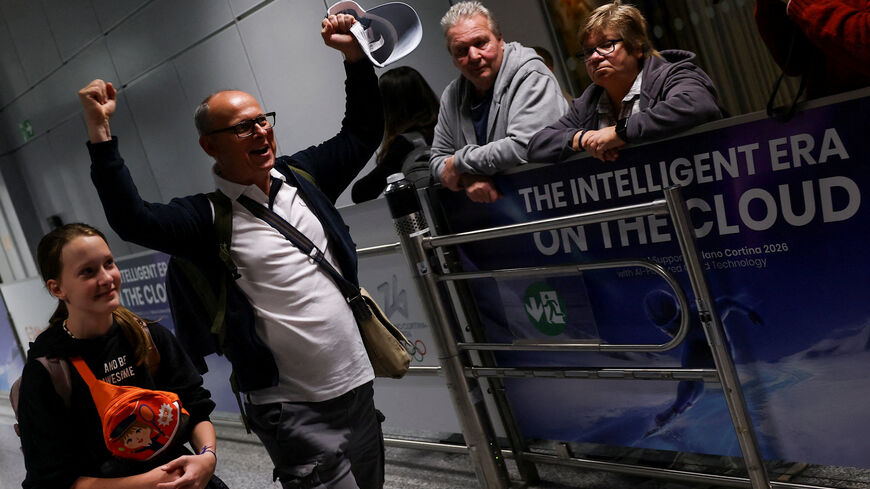 An unidentified passenger gestures following the evacuation from Dubai, amid the U.S.-Israeli conflict with Iran, at the airport in Frankfurt, Germany, March 3, 2026. REUTERS/Kai Pfaffenbach
