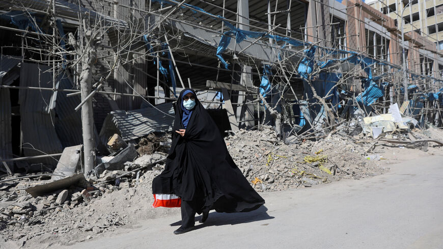 A woman walks on the street following an Israeli and U.S. strike on a police station, amid the U.S.-Israeli conflict with Iran, in Tehran, Iran, March 3, 2026. Majid Asgaripour/WANA (West Asia News Agency) via REUTERS