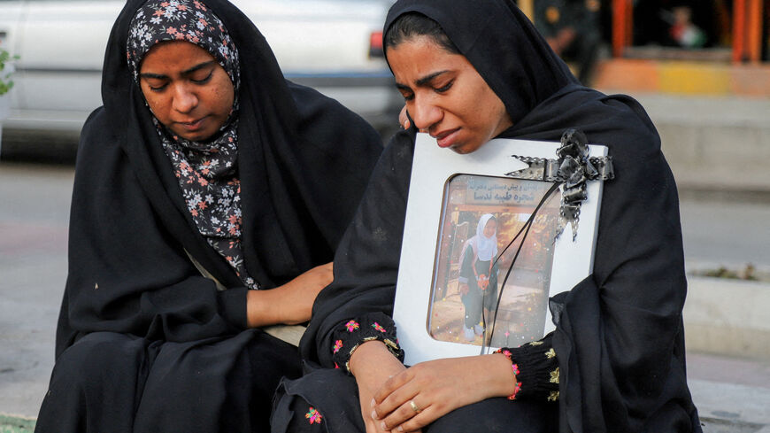 FILE PHOTO: People mourn on the day of the funeral of the victims following a reported strike on a school in Minab, Iran, March 3, 2026. Amirhossein Khorgooei/ISNA/WANA (West Asia News Agency) via REUTERS