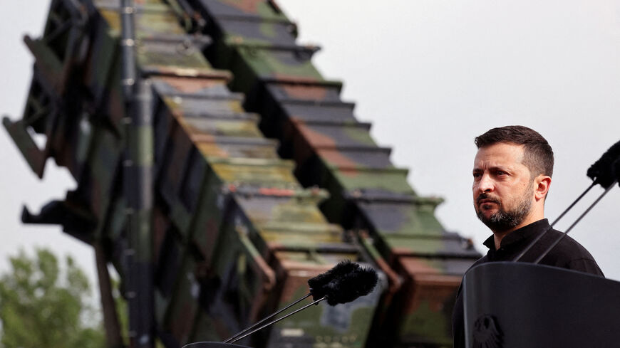 Ukrainian President Volodymyr Zelenskiy looks on during a visit to a military training area to find out about the training of Ukrainian soldiers on the “Patriot” anti-aircraft missile system, at an undisclosed location, in Germany, June 11, 2024. Jens Buttner/Pool via REUTERS