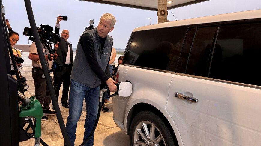 FILE PHOTO: U.S. Energy Secretary Chris Wright pumps gas at a gas station in Corpus Christi, Texas, U.S.,  February 27, 2026. REUTERS/Sheila Dang/File Photo