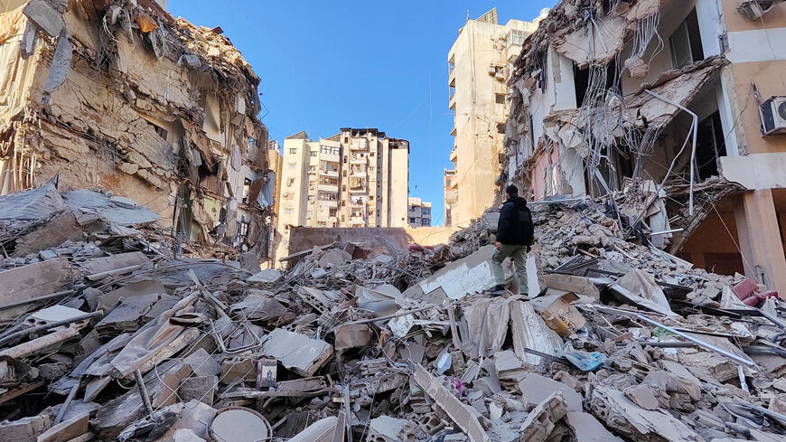 A man stands near a damaged building after an Israeli strike on Beirut's southern suburbs, following renewed hostilities between Hezbollah and Israel amid the U.S.-Israeli conflict with Iran, Lebanon, March 5, 2026. Picture taken with a mobile phone. REUTERS/Stringer