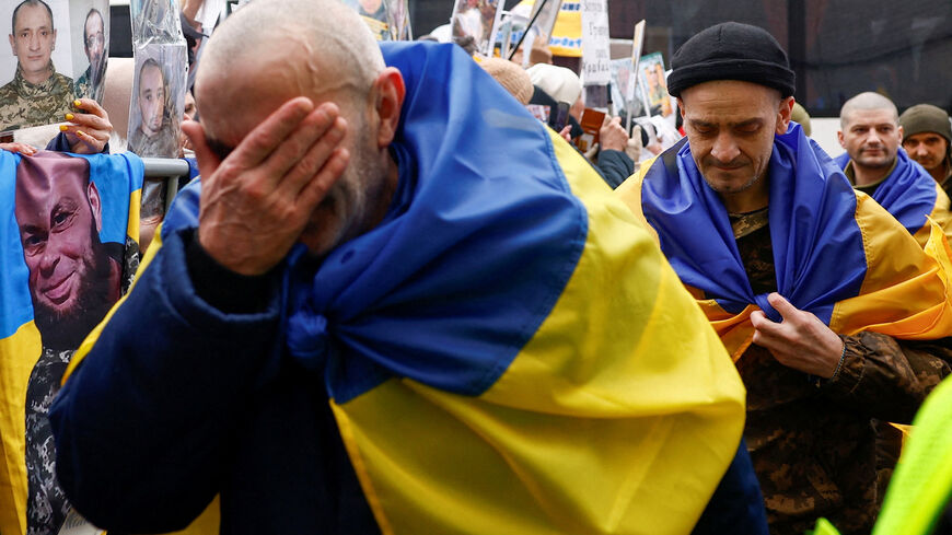 Freed Ukrainian prisoners of war (POWs) react while they leave a bus after a swap, amid Russia's attack on Ukraine, in an undisclosed location in Ukraine, in an undisclosed location, in Ukraine March 5, 2026. REUTERS/Valentyn Ogirenko