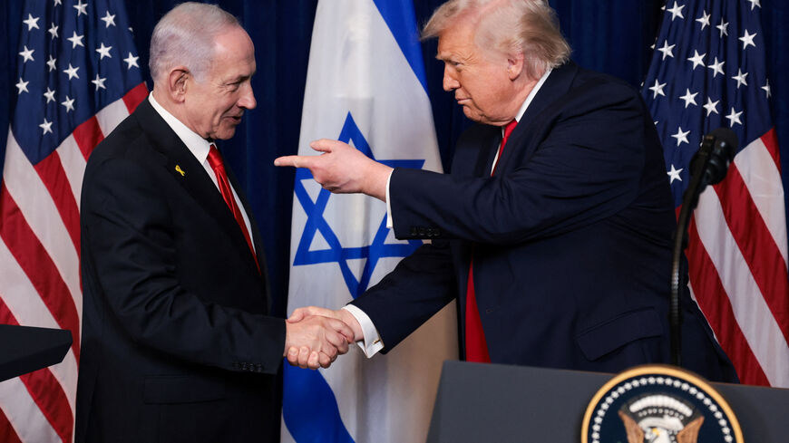 U.S. President Donald Trump points his finger towards Israeli Prime Minister Benjamin Netanyahu as they shake hands during a press conference after meeting at Trump’s Mar-a-Lago club in Palm Beach, Florida, U.S., December 29, 2025. REUTERS/Jonathan Ernst