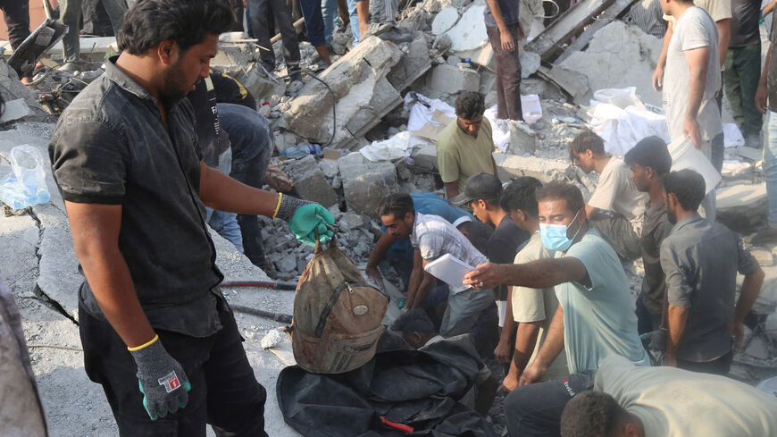 FILE PHOTO: People and rescue forces work following an Israel strike on a school in Minab, Iran, February 28, 2026. Abbas Zakeri/Mehr News/WANA (West Asia News Agency) via REUTERS/File Photo