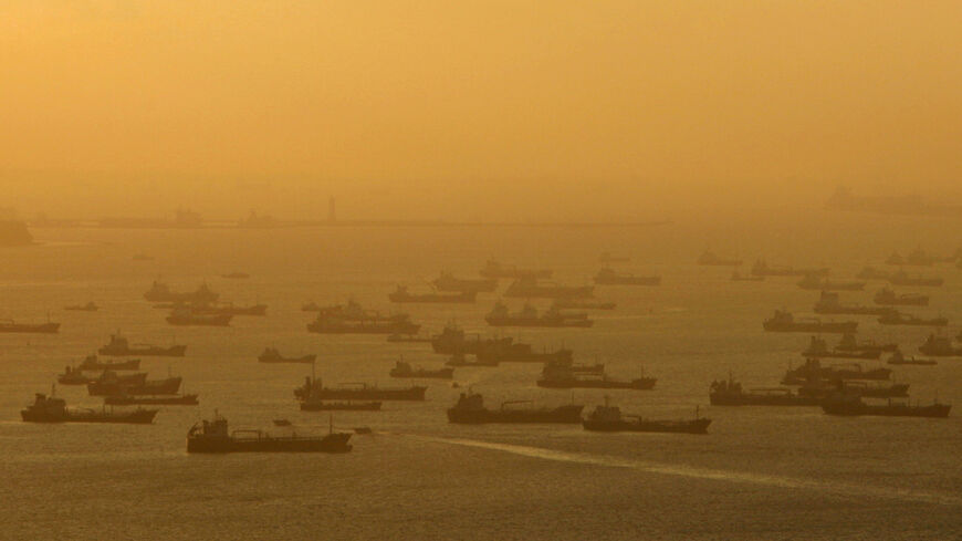 FILE PHOTO: Shipping vessels and oil tankers line up on the eastern coast of Singapore in this July 22, 2015.  REUTERS/Edgar Su/File Photo/File Photo