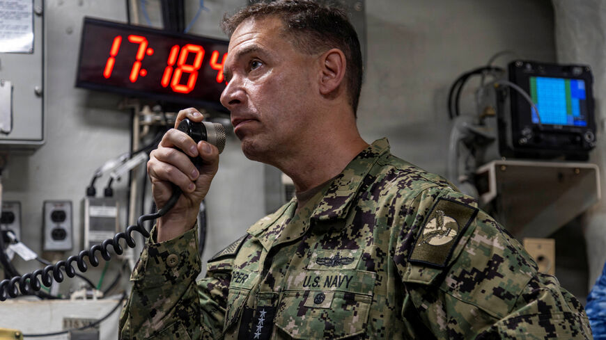 U.S. Navy Admiral Brad Cooper, commander of U.S. Central Command, makes an announcement aboard Nimitz-class aircraft carrier USS Abraham Lincoln in the Arabian Sea February 7, 2026.  U.S. Navy/Mass Communication Specialist 2nd Class Sonny Escalante/Handout via REUTERS