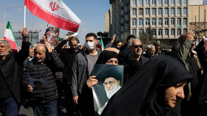 A demonstrator holds an image of Iran's late Supreme Leader Ayatollah Ali Khamenei, after he was killed in Israeli and U.S. strikes on Saturday, during an anti-Israeli and U.S. rally after Friday prayer, amid the U.S.-Israeli conflict with Iran, in Tehran, Iran, March 6, 2026. Majid Asgaripour/WANA (West Asia News Agency) via REUTERS