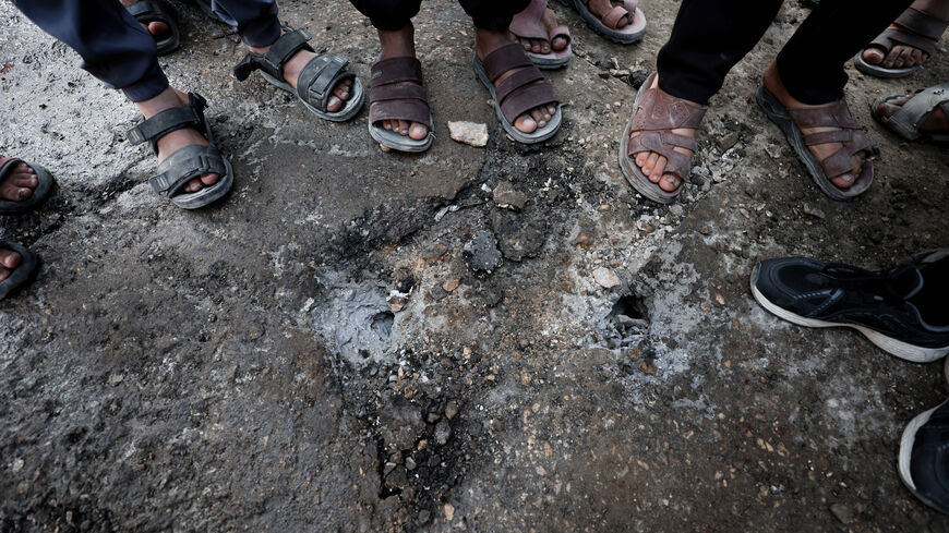 Palestinians gather to inspect the damage at the site hit by an Israeli strike, according to health officials, in Gaza City, March 8, 2026. REUTERS/Dawoud Abu Alkas