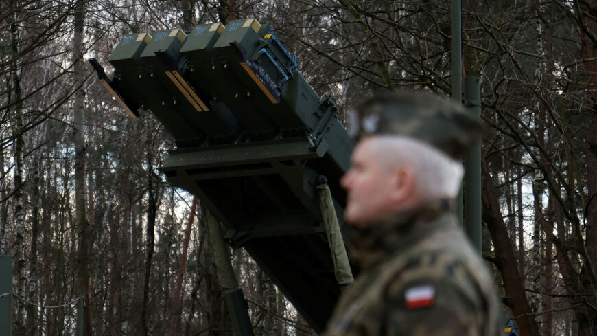 Polish army general stands in front of the surface-to-air missile launcher, the Patriot (Wisla) system, newly added into the Integrated Battle Command System (IBCS) at an army base in Sochaczew, Poland, December 18, 2024. REUTERS/Kuba Stezycki